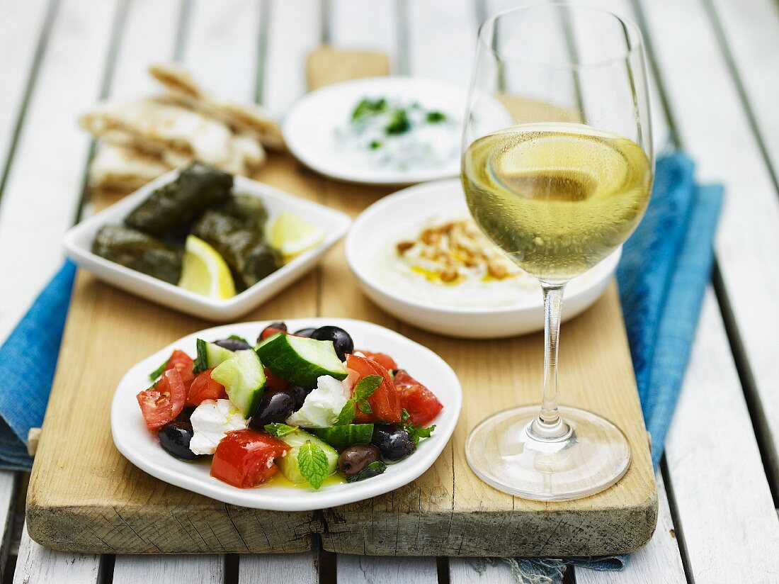Greek food, white wine and unleavened bread