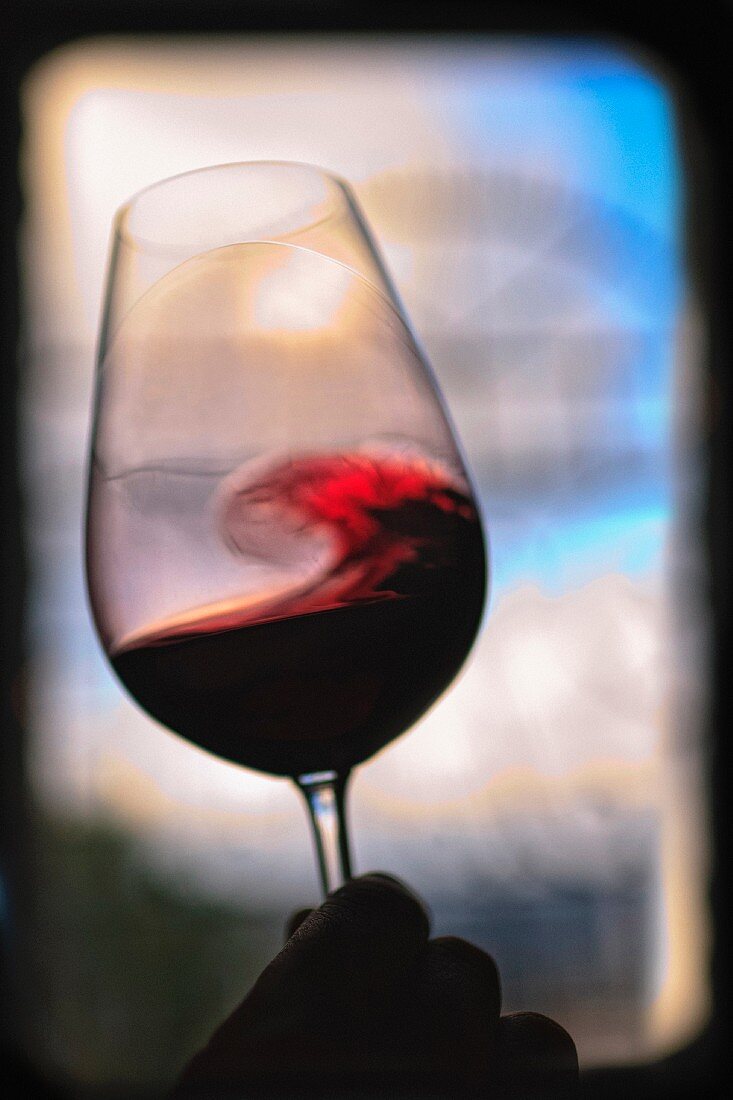 Red wine being swirled in a glass