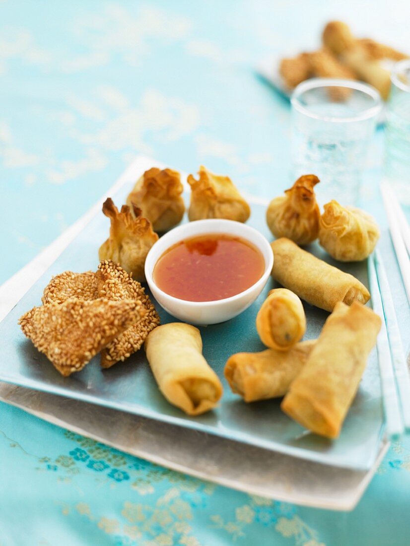 Fried spring rolls and parcels with chilli sauce