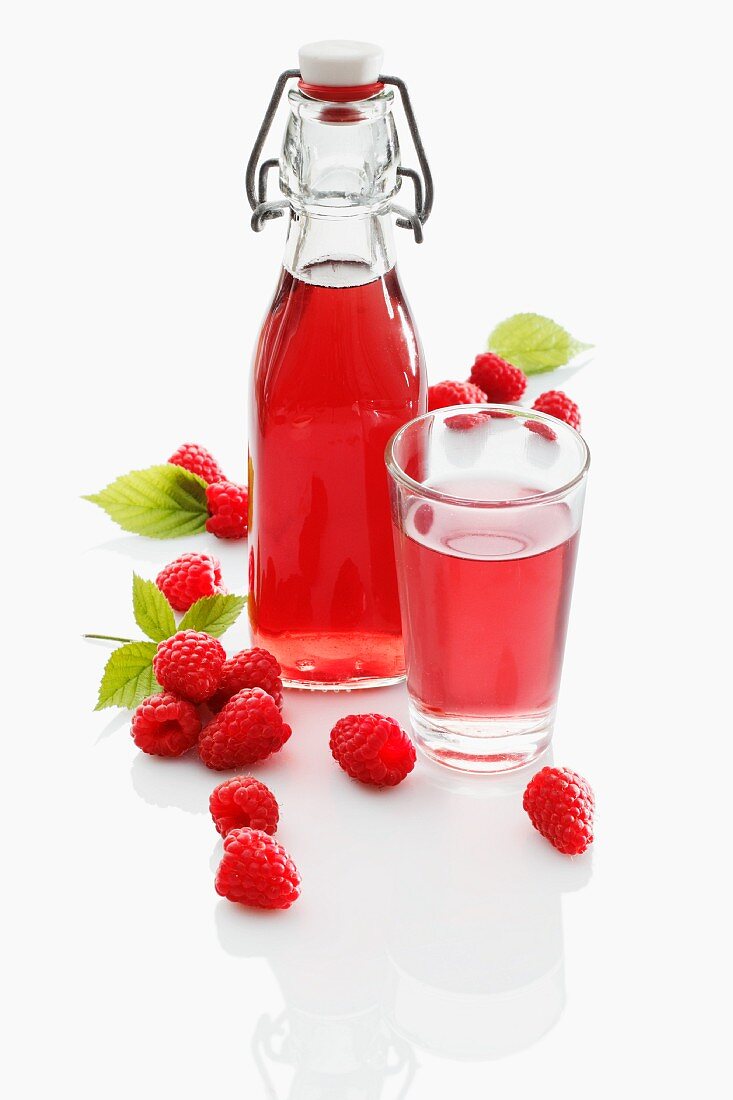 Raspberry juice and fresh raspberries
