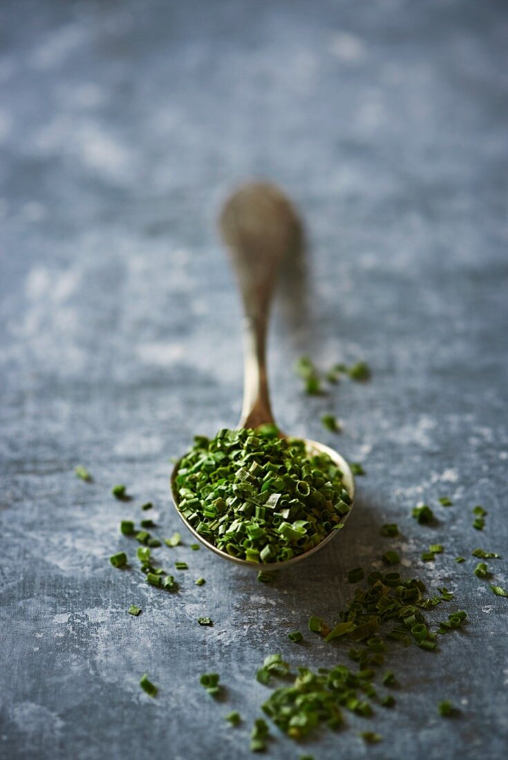 Dried chives on a spoon