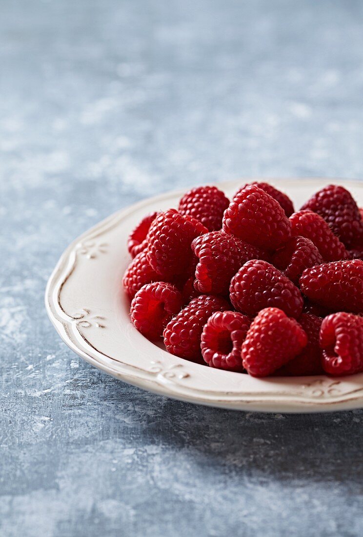 A plate of fresh raspberries