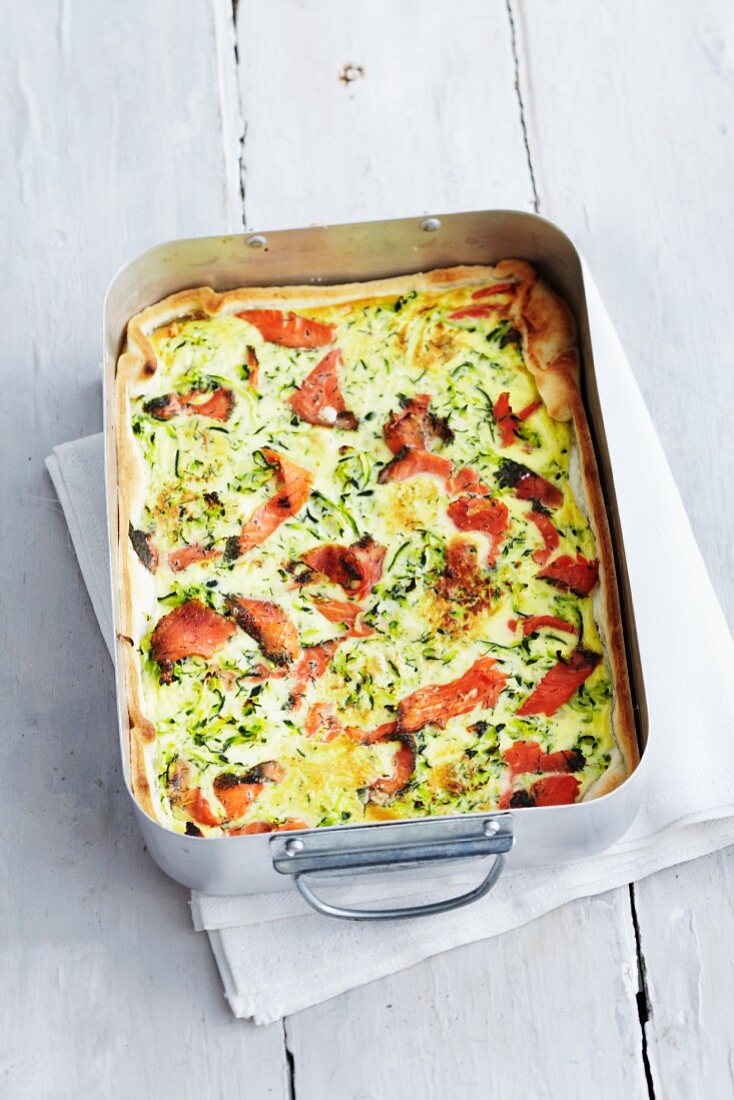 Quiche with salmon and courgette in a baking tin