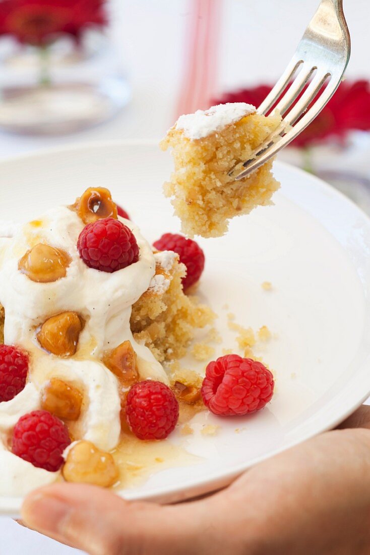 Hazelnut cake with vanilla cream and raspberries