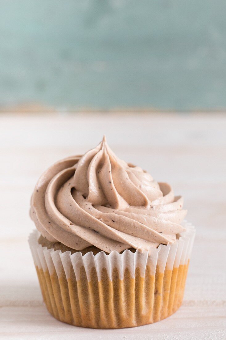 A hazelnut cupcake topped with buttercream