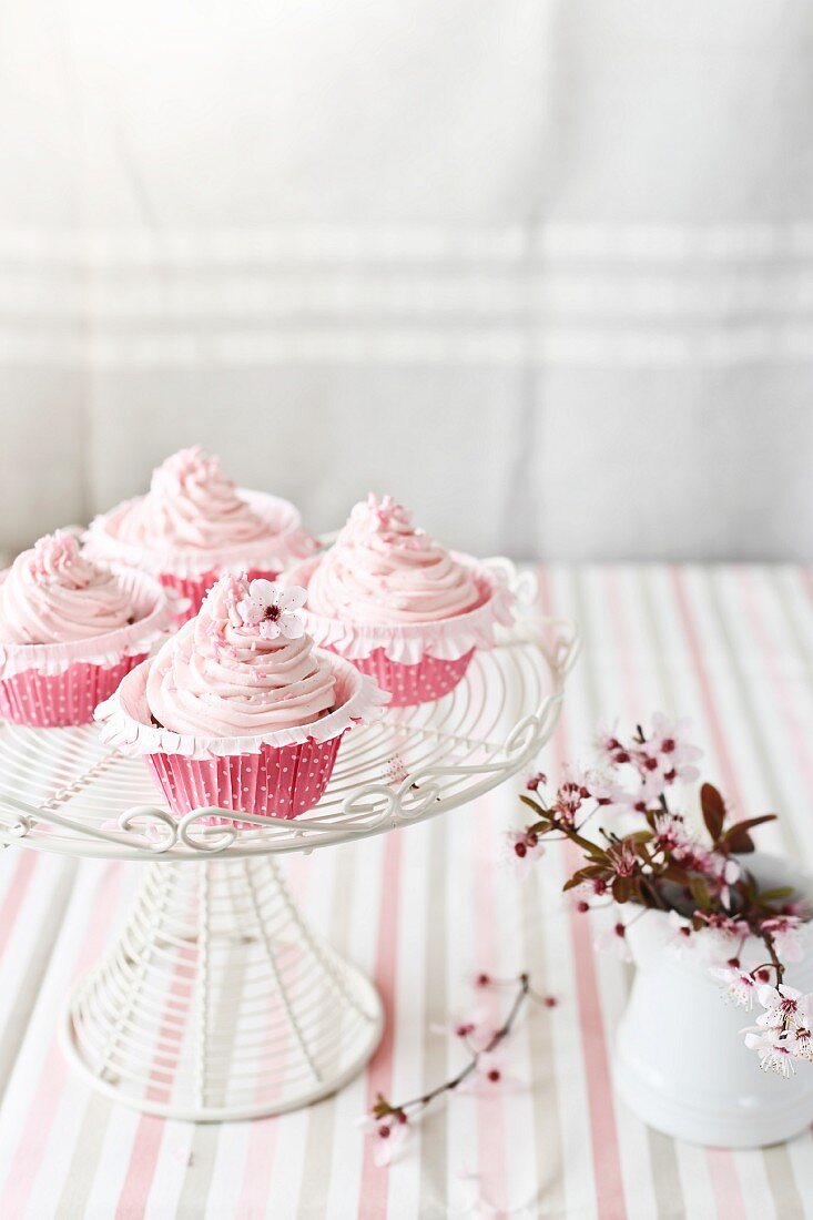Pink cupcakes decorated with buttercream