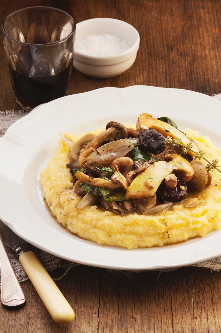 Mushroom ragout with bacon on a bed of polenta