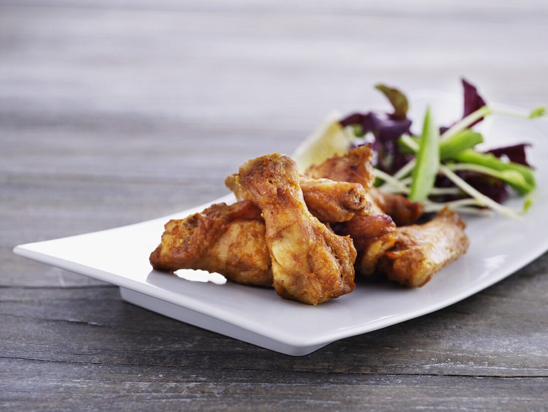 Chicken wings with a mixed leaf salad