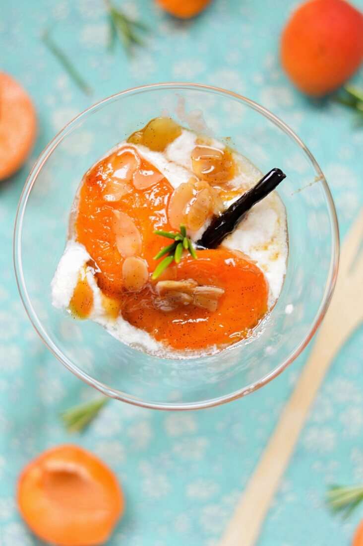 Roasted apricots with ice cream and slivered almonds