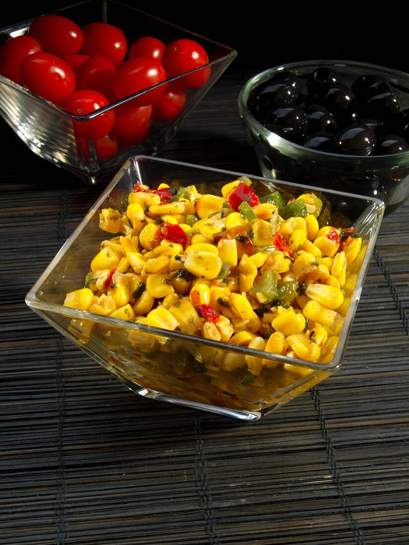 Spicy corn salad in glass bowl