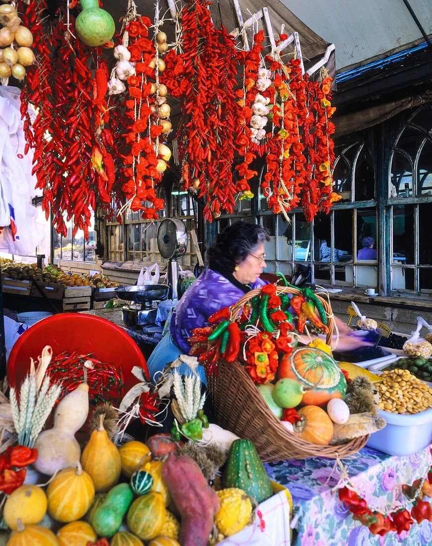 Pumpkins and chilli peppers on a market stall in Porto (Portugal)