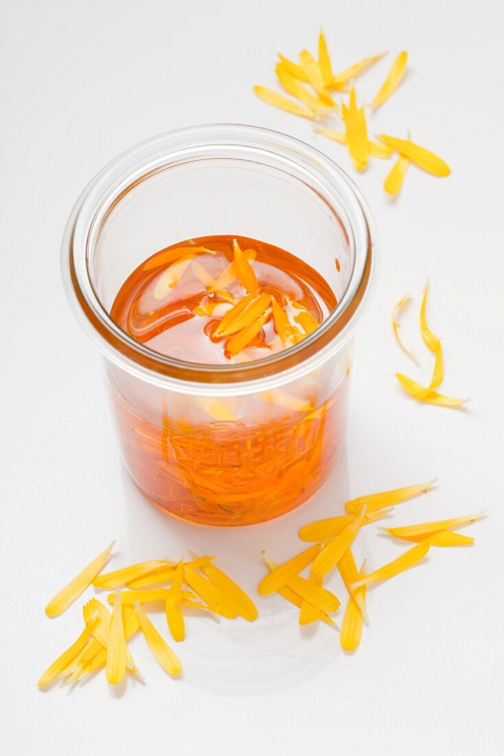 Homemade marigold oil made from thistle oil and marigold petals