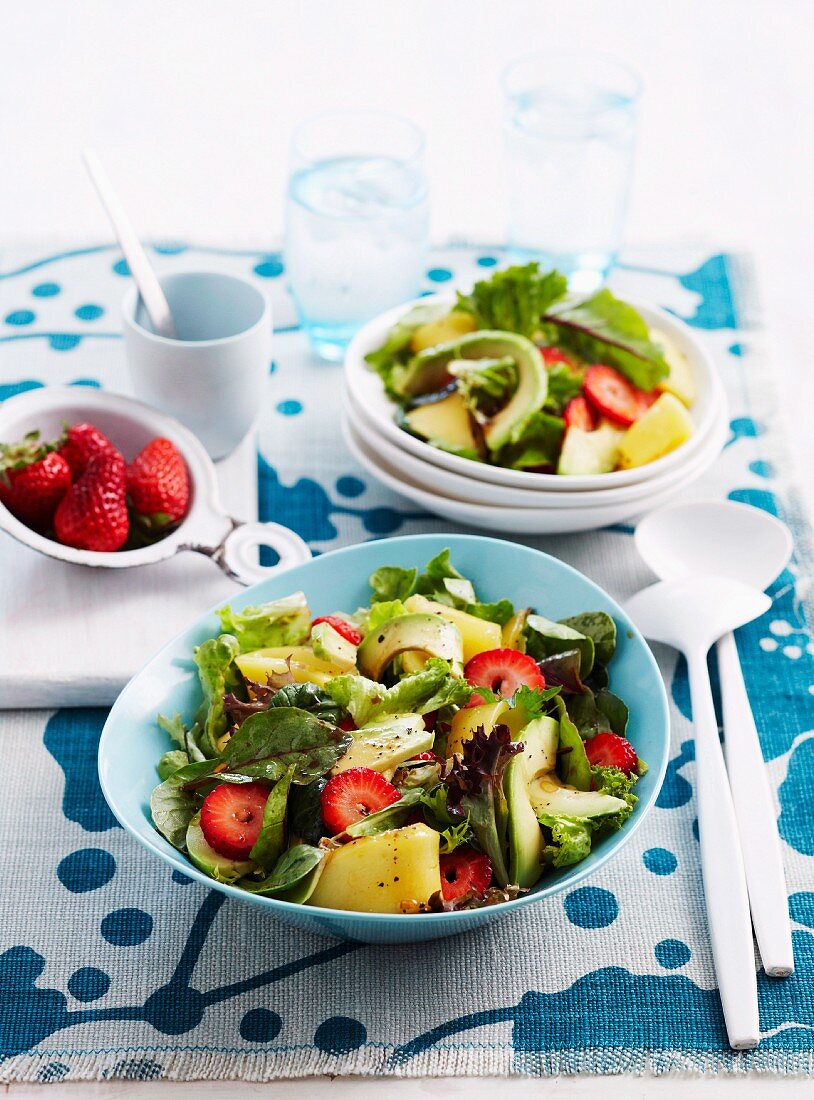 Mixed summer salad with strawberries, mango and avocado