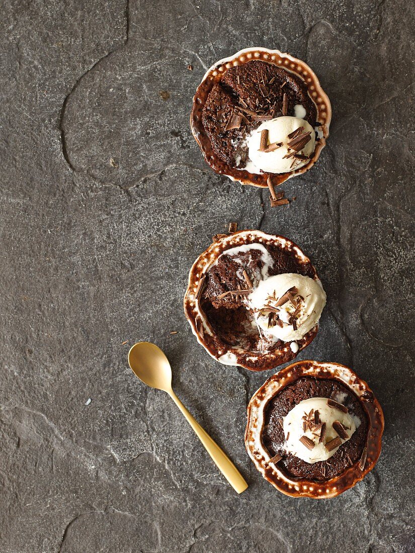 Baked chocolate puddings with vanilla ice cream