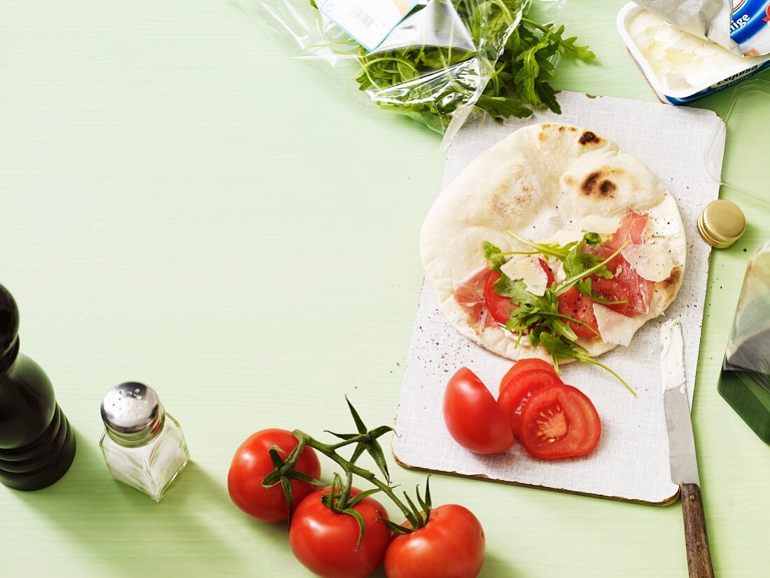 Piadina (unleavened Italian bread) with tomato and rocket