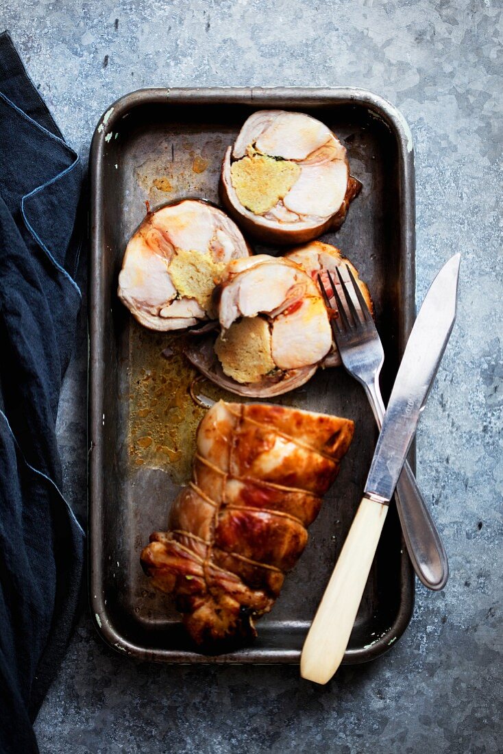 Rabbit roulade in a roasting tin