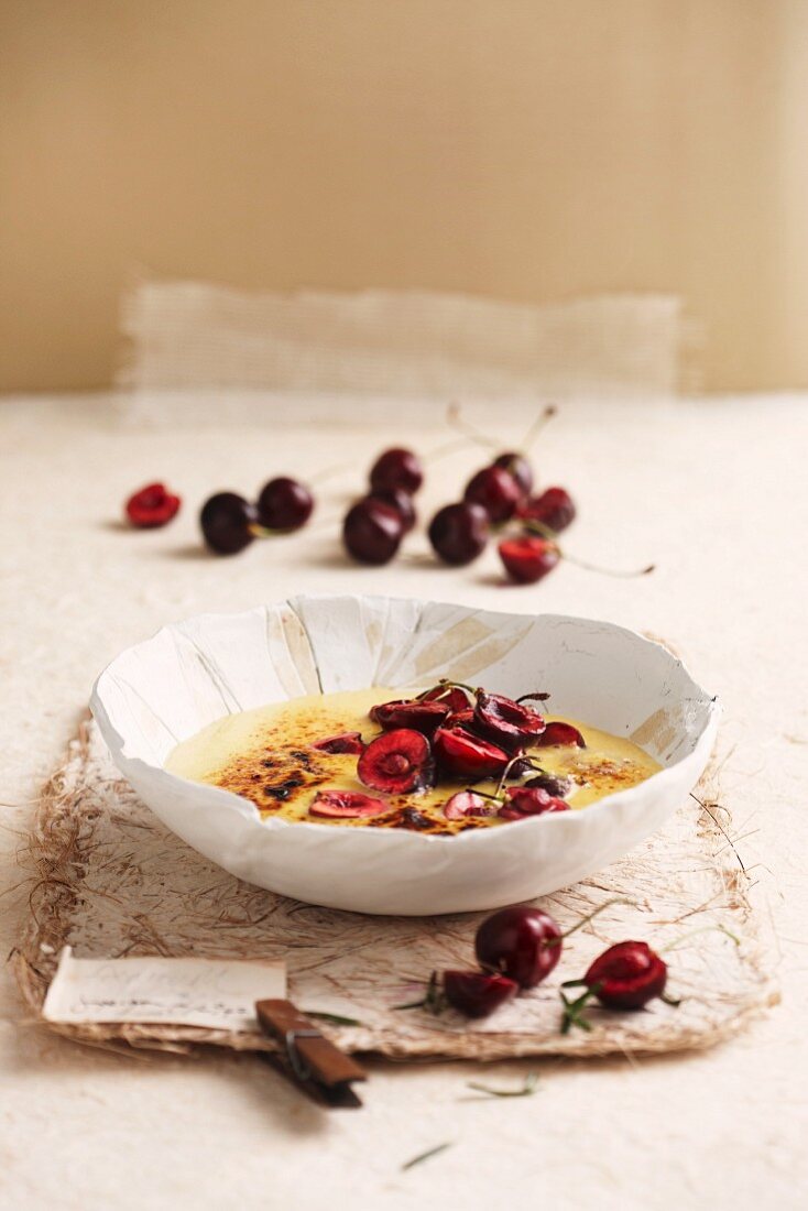 Gratinated almond pudding with cherries