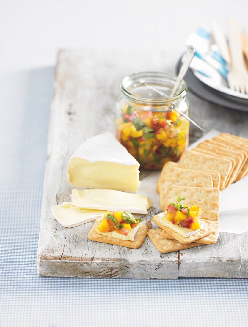 Mango chutney with Camembert and crackers for a picnic