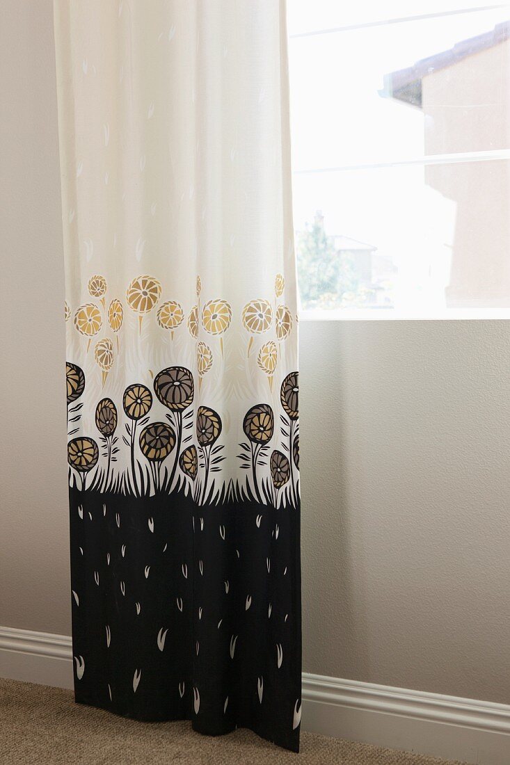 Patterned curtain at window; Murrieta; California; USA