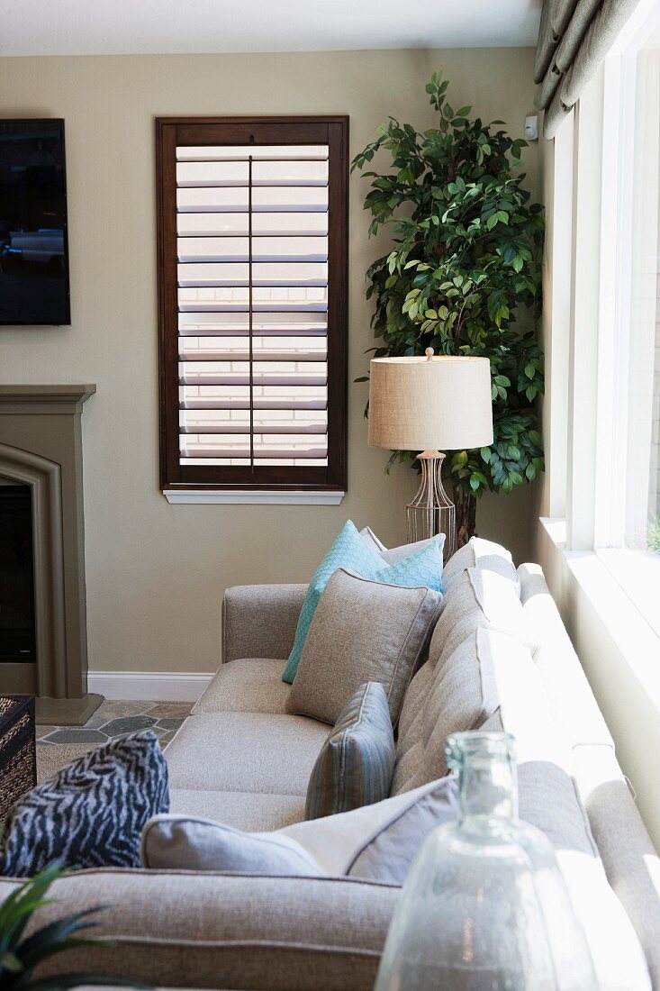 Cushions on sofa in seating area; Valencia; California; USA