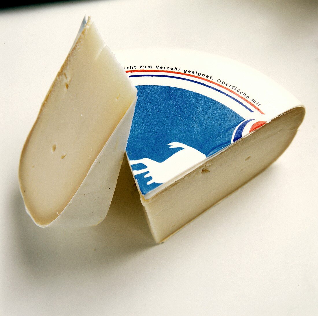 Two Wedges of Packaged Gouda Cheese