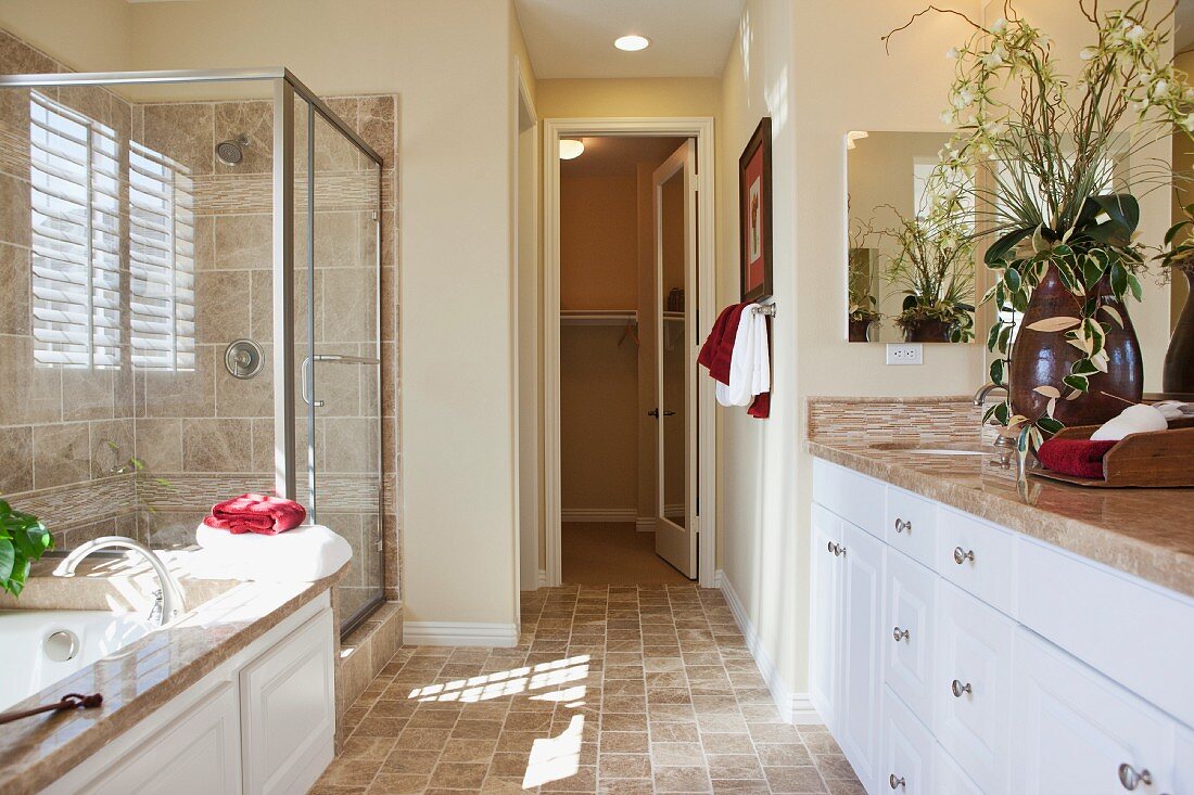 Contemporary bathroom with cropped bath and glass shower