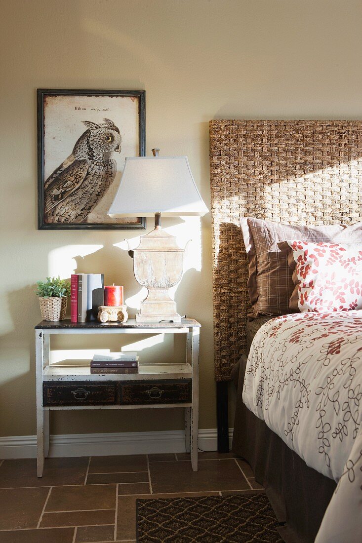 Lamp on bedside table in bedroom