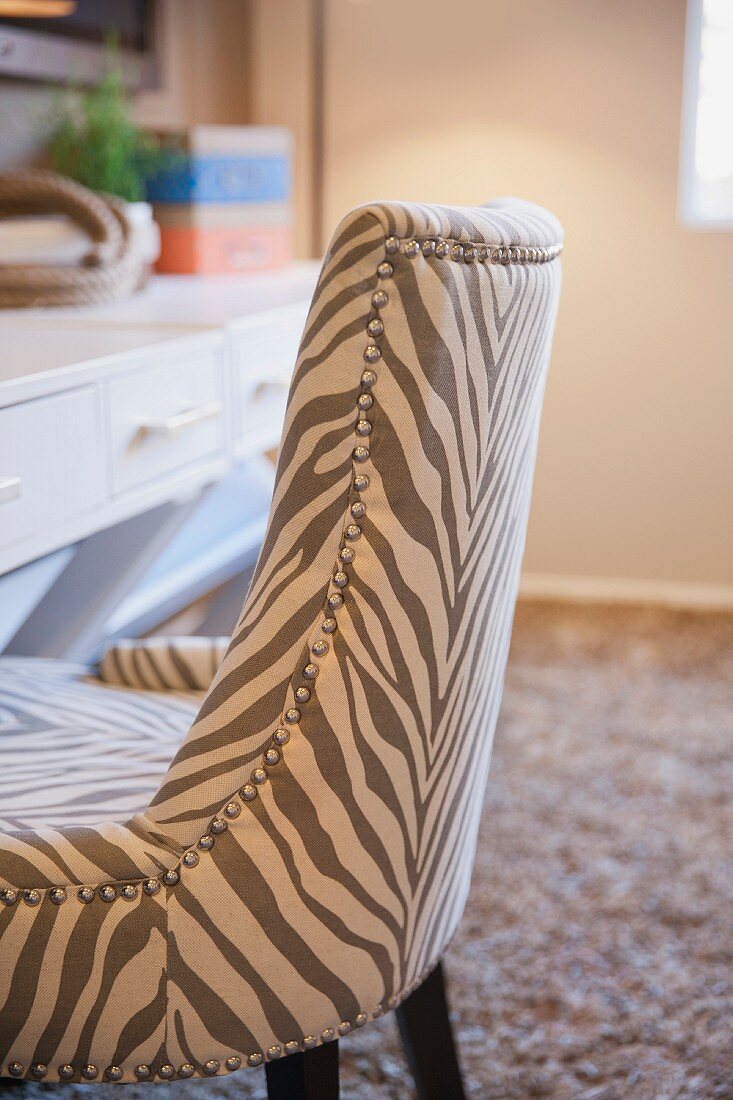 Detail of upholstered chair at table; Moreno Valley; California; USA