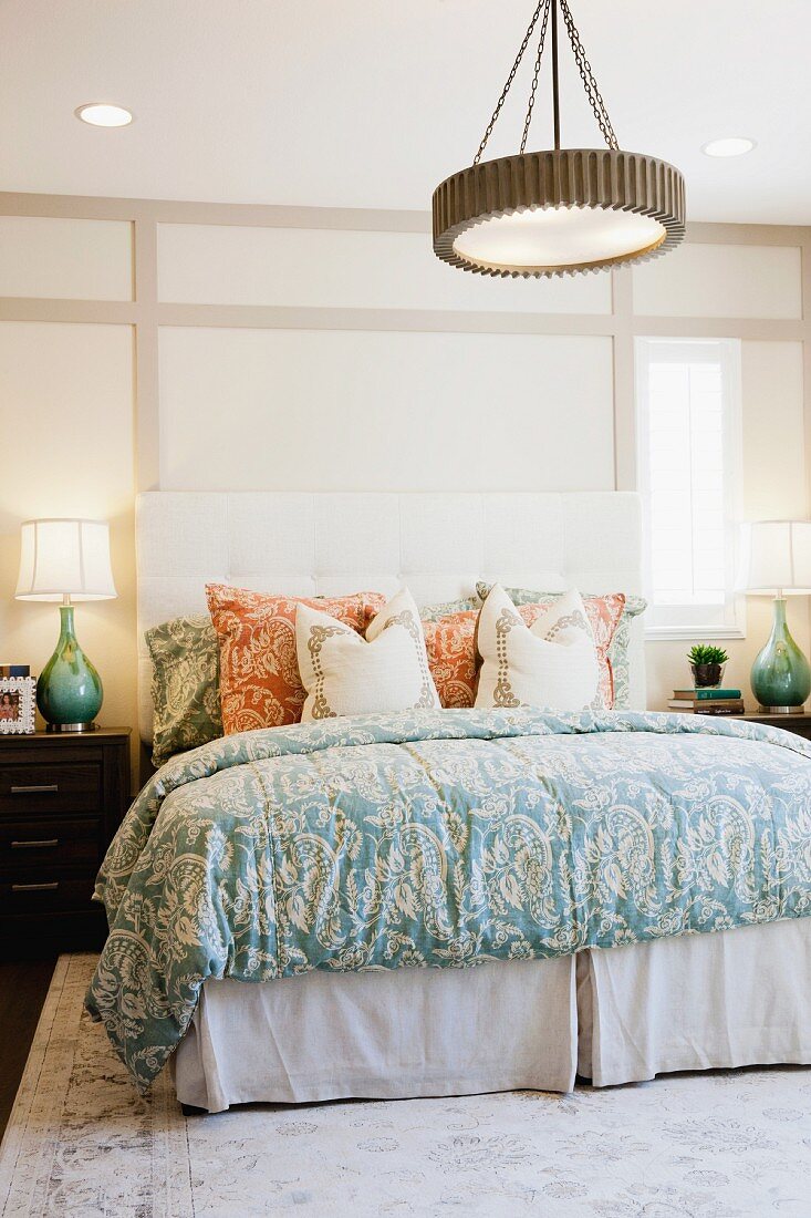 Bedroom with pendant lamp over bed; Palm Desert; California; USA