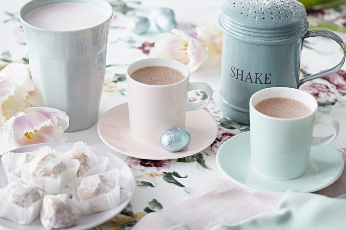 Two cups of hot chocolate with sweets