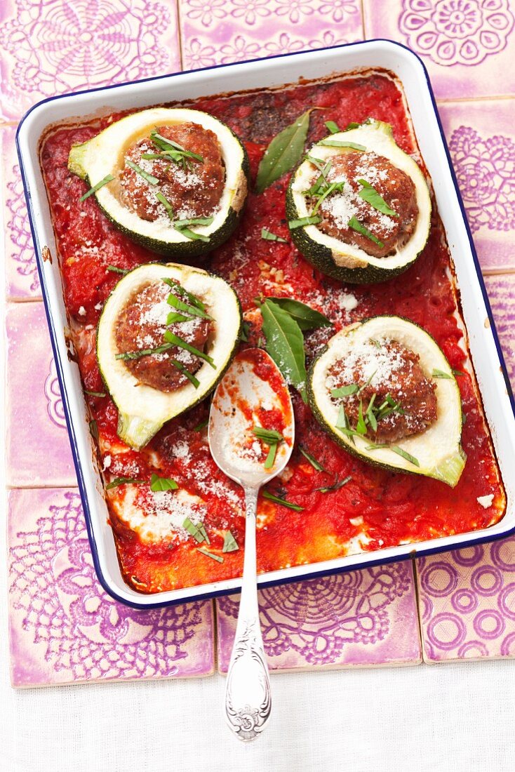 Round courgettes filled with minced meat in a tomato sauce