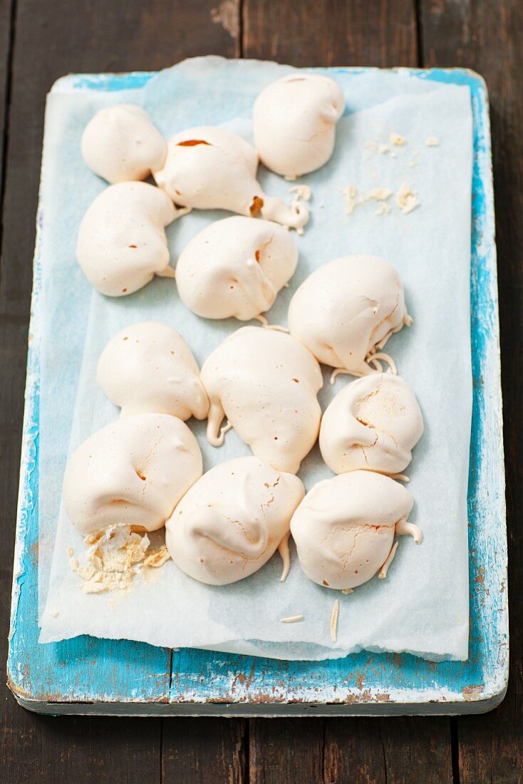 Homemade meringues on parchment paper