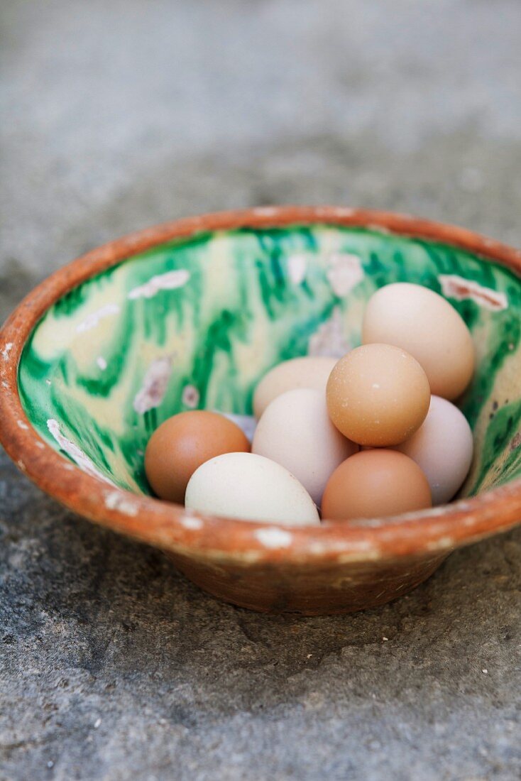 Fresh eggs in a vintage ceramic bowl