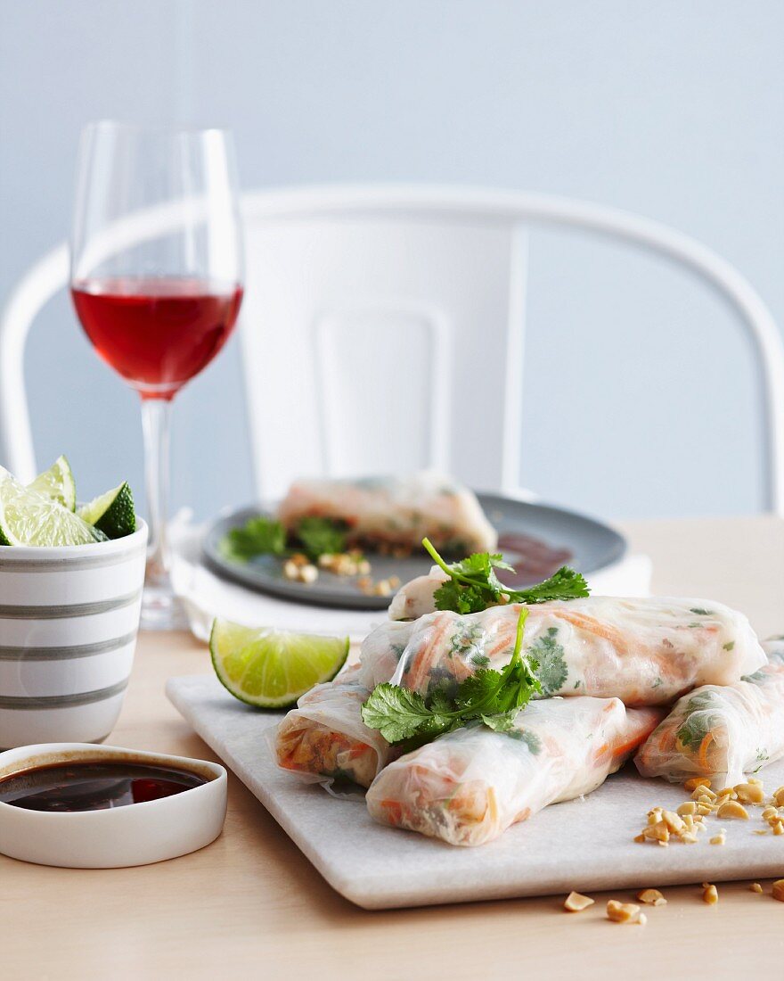 Vietnamese summer rolls with prawns, tamarind and herbs on a chopping board