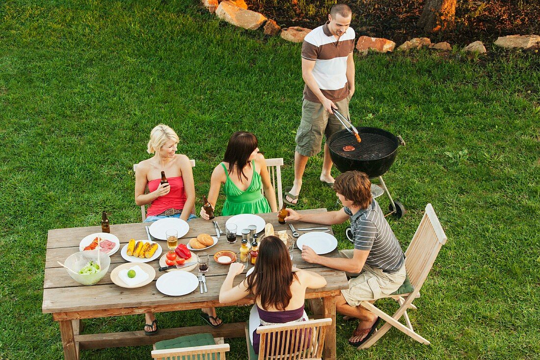 Friends eating together outdoors