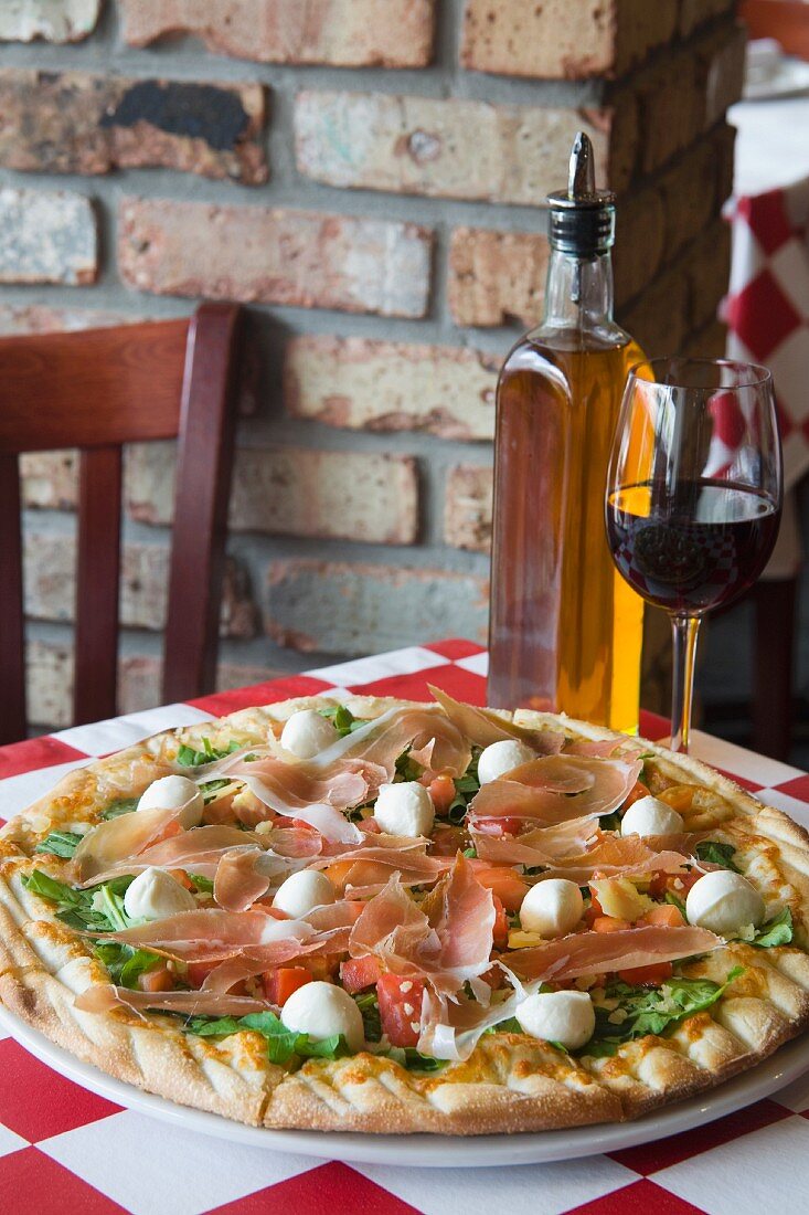 Pizza with delicious toppings on table at Archie's Pizza