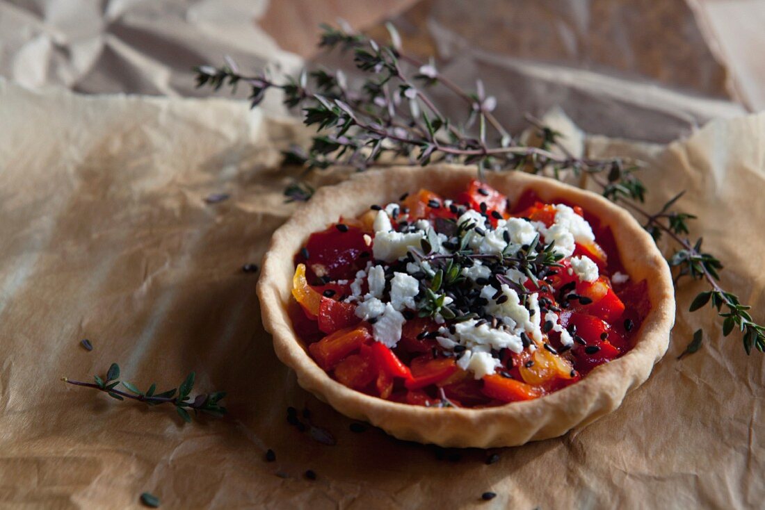 Pepper tart with feta cheese, sesame seeds and thyme