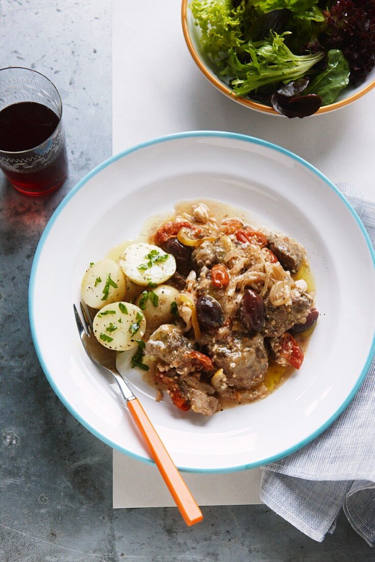 Braised shoulder of lamb with olives and lemons (Greece)