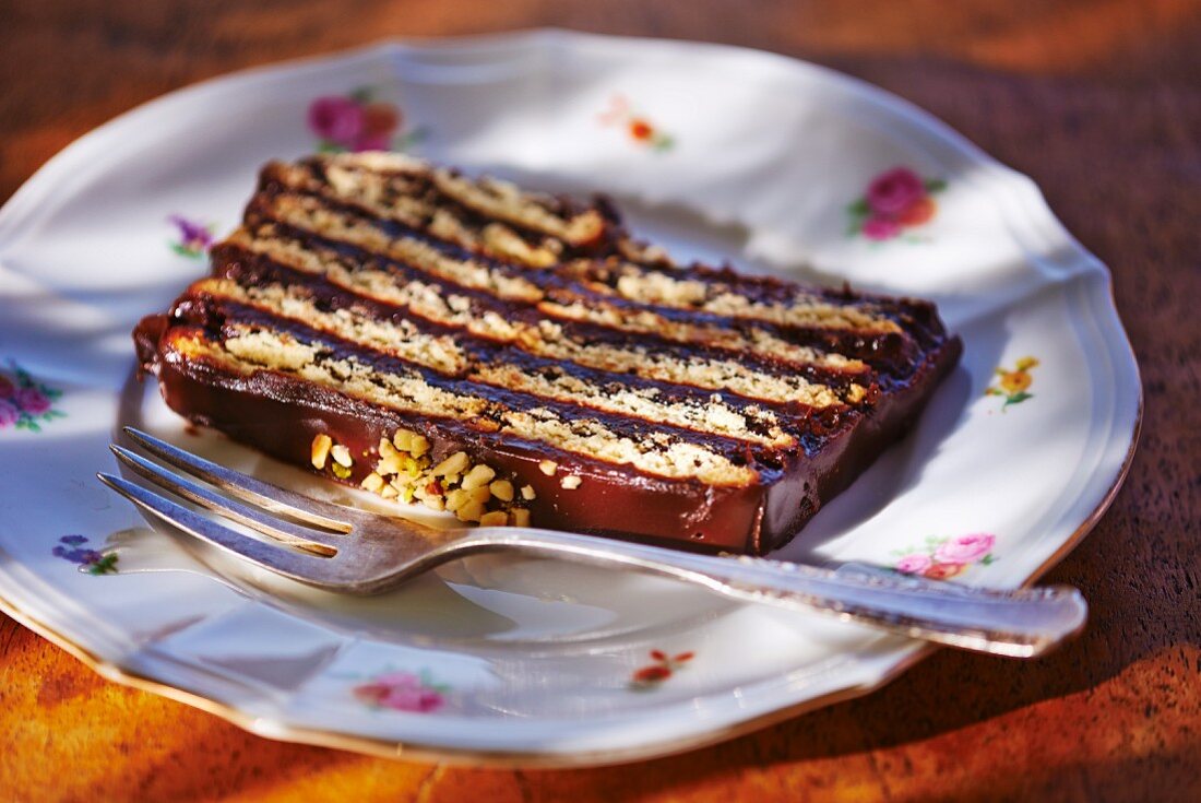 A piece of hedgehog slice with chopped nuts