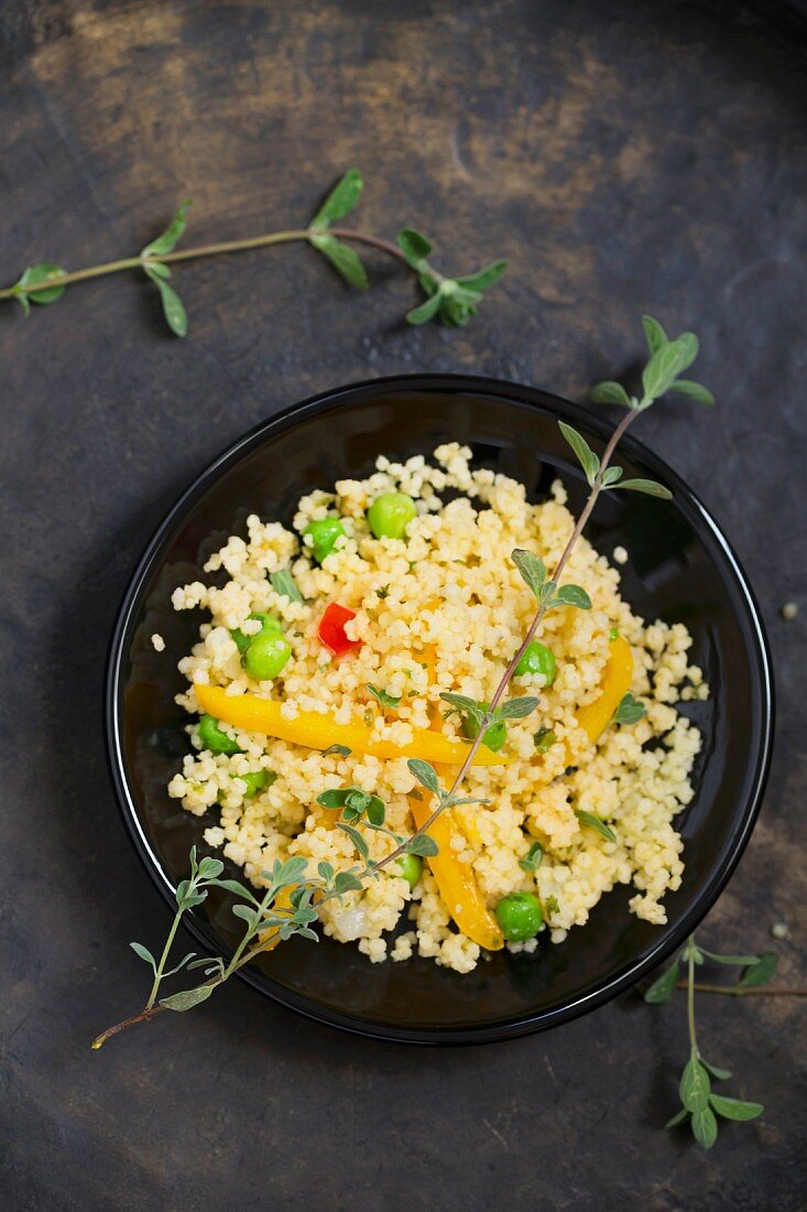 Fried millet with peppers and peas