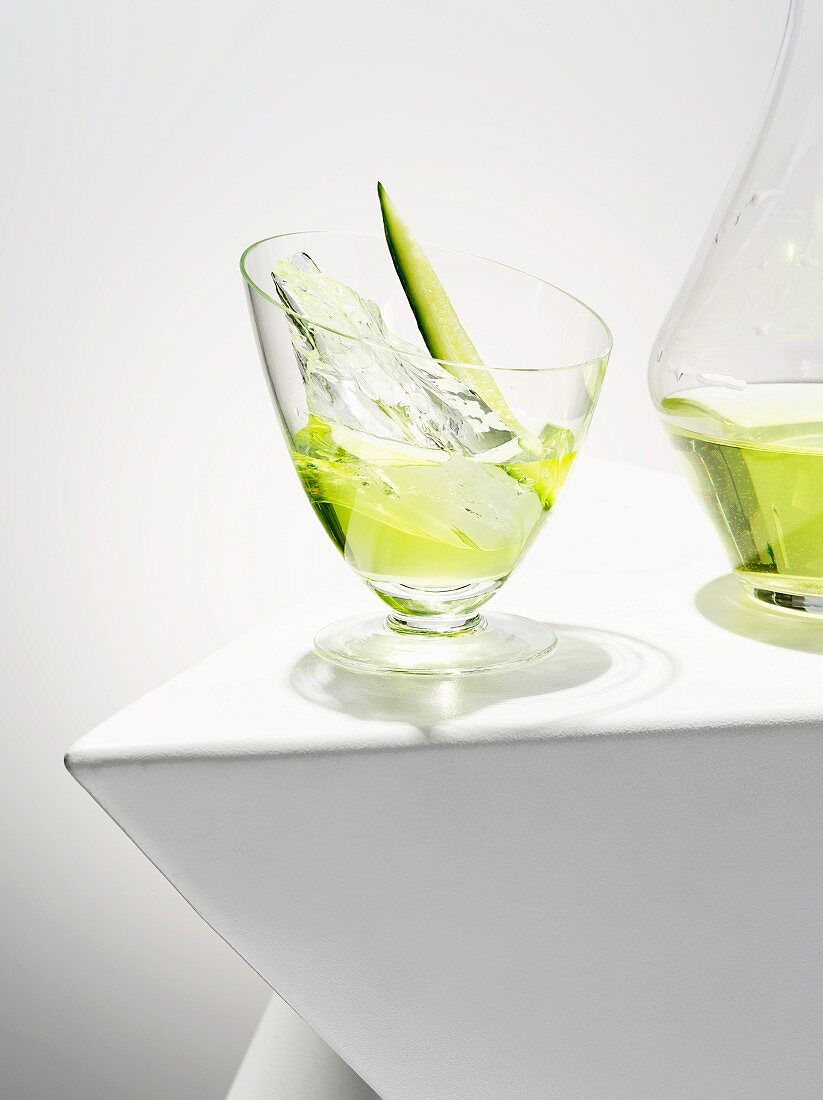 A cucumber cocktail with ice cubes