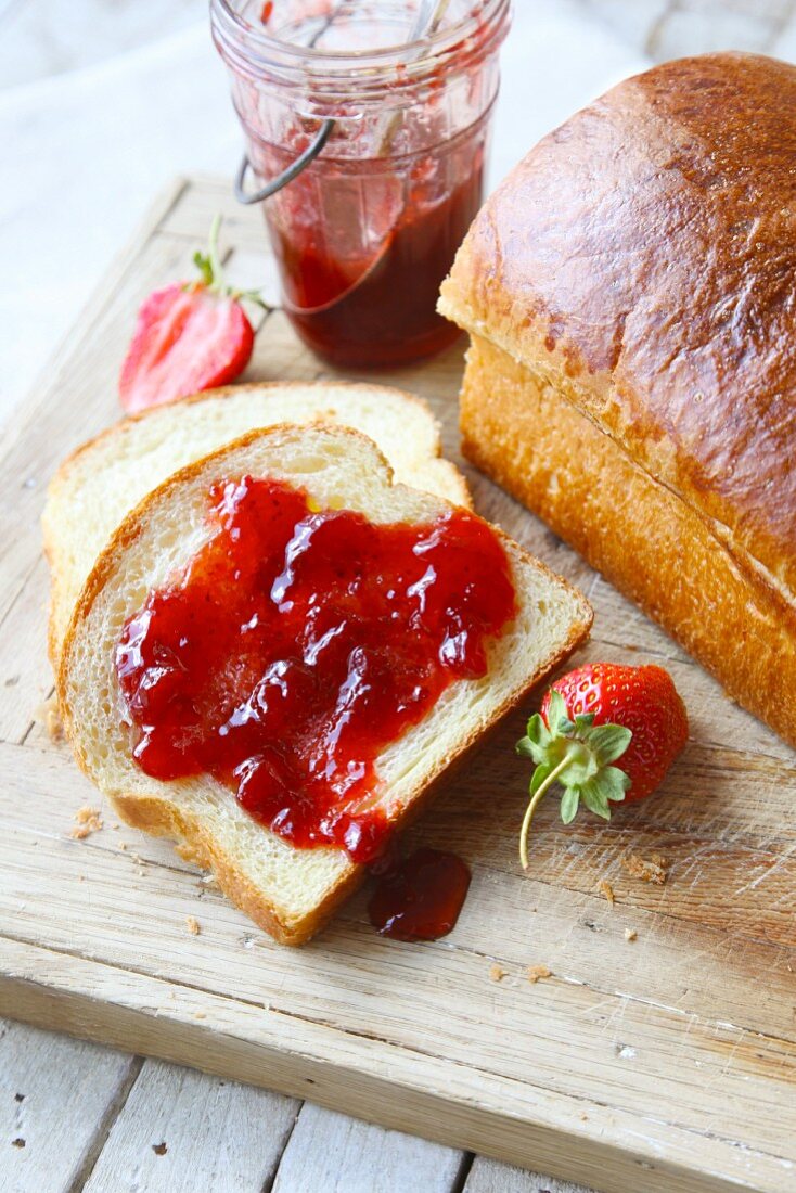 Strawberry jam on a slice of white bread