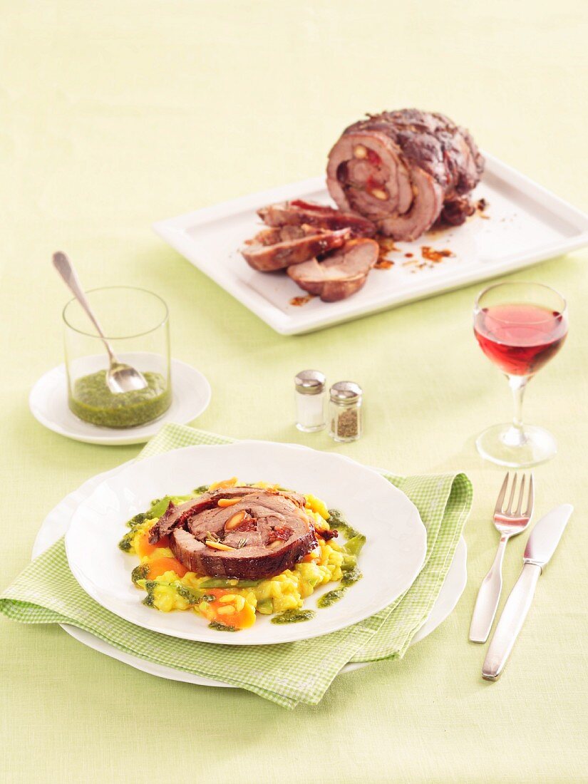 Lamb roulade with risotto and pesto