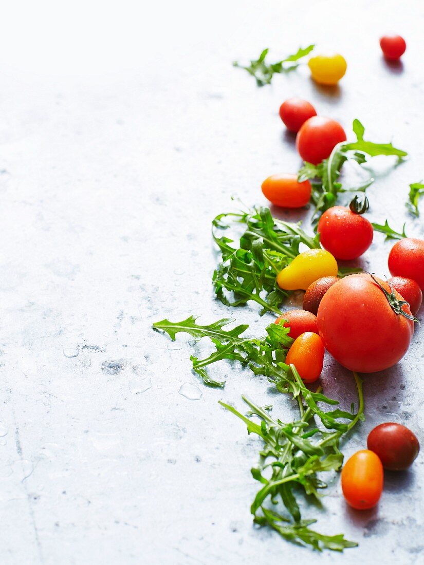 Various types of tomatoes and rocket