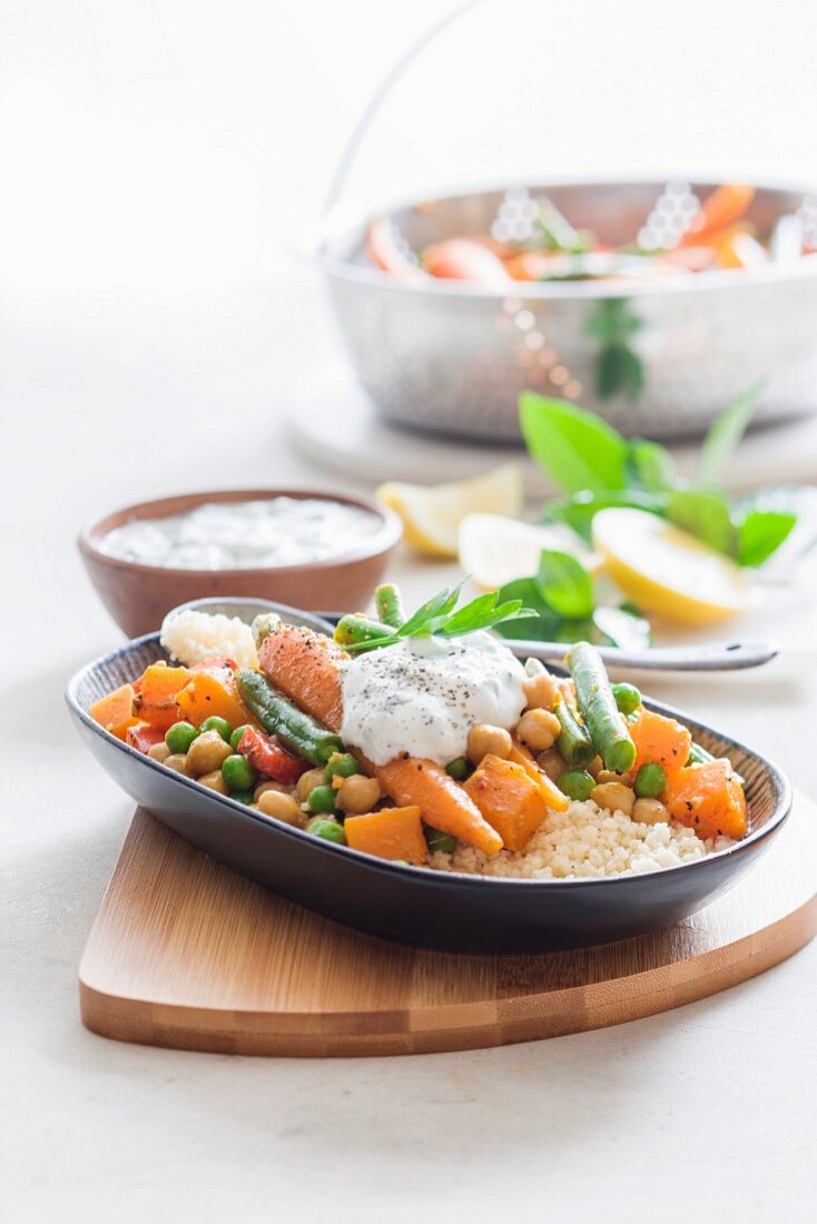 Moroccan vegetables on a bed of couscous with mint yoghurt