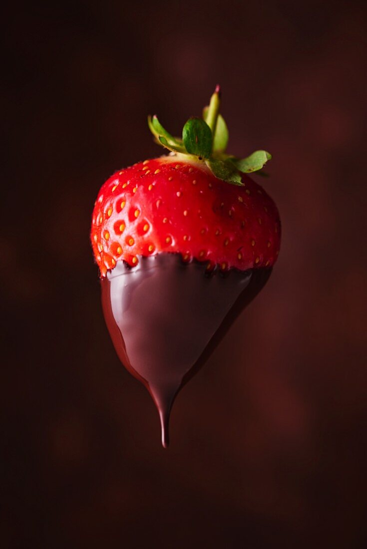 A strawberry dipped in chocolate glaze