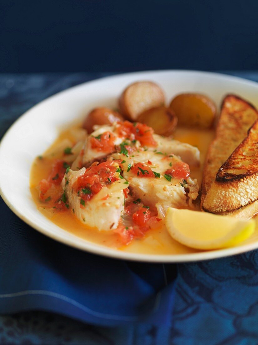Poached fish in a fresh tomato sauce