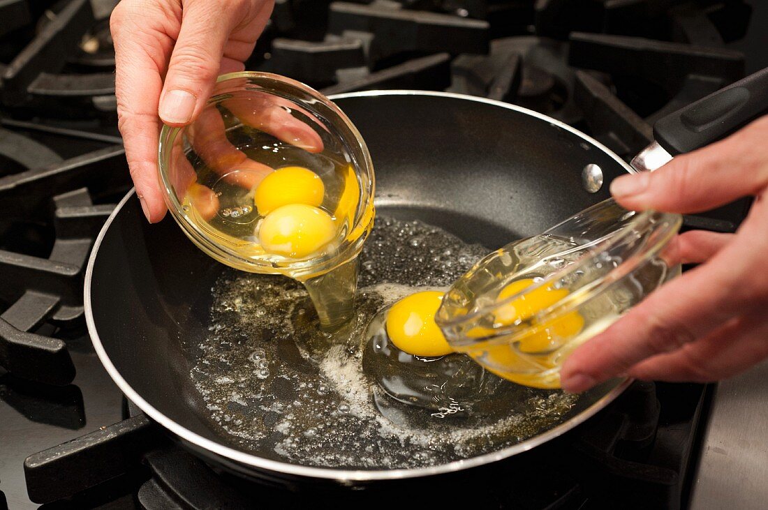 Fried eggs being made