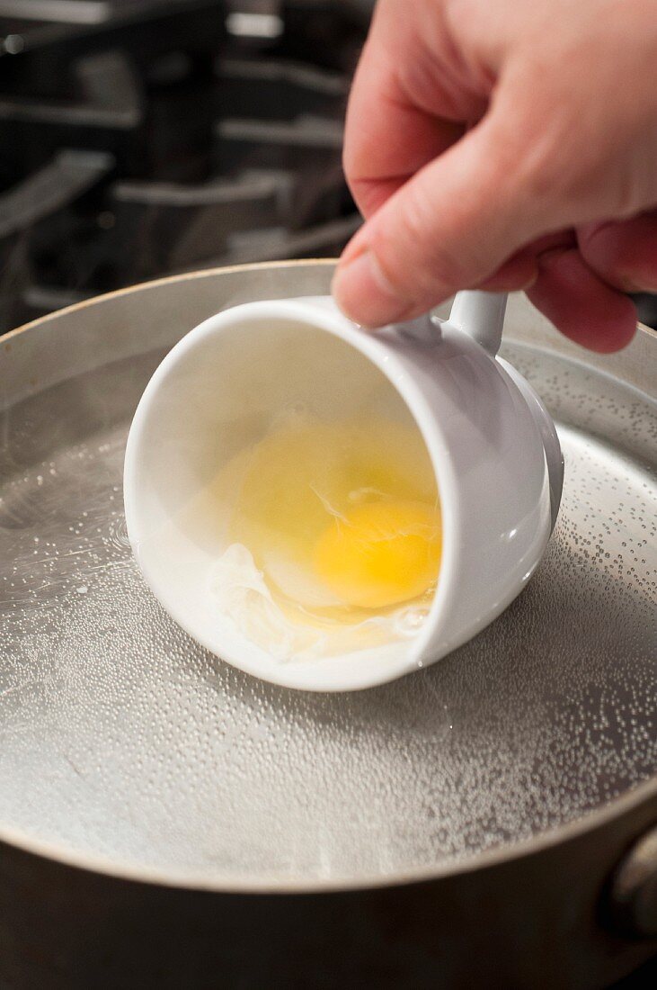 An egg being poached