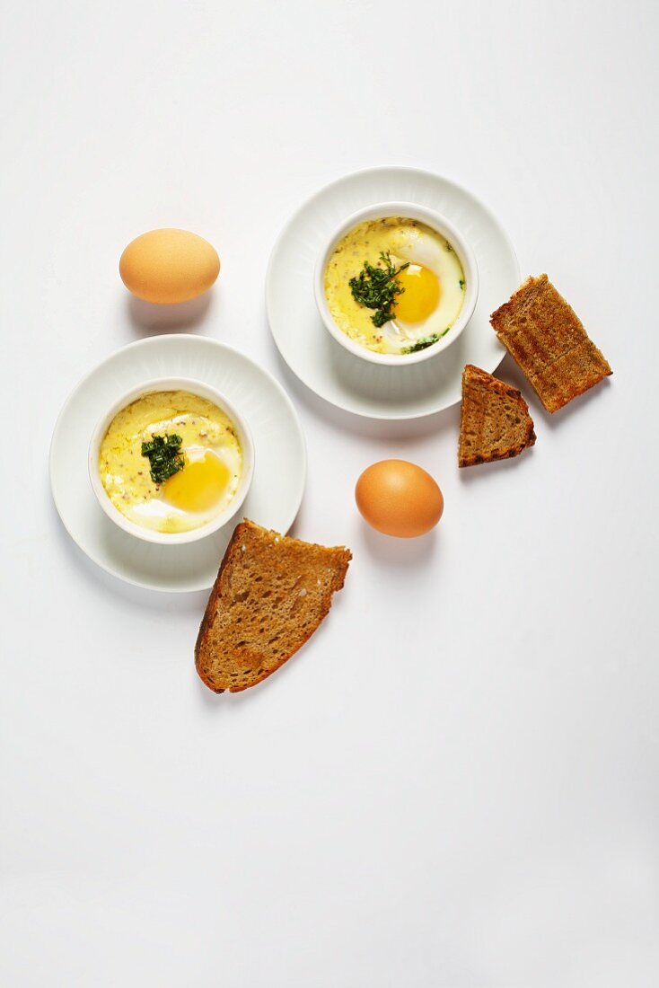 Oeufs en cocotte with spring herbs (France)